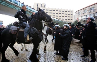 Haredim protest arrest of draft-dodger