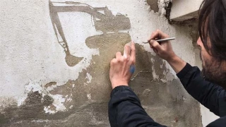 Artist portrays Palestinian refugees plight on walls