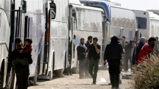 Biggest convoy of evacuees leaves Syria's Eastern Ghouta
