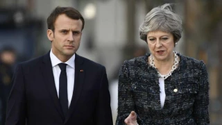 May to Macron and Trump: UK won't strike Syria without more evidence