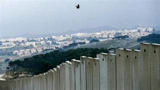Infuriated by settlement blacklist, Israel freezes ties with UN rights chief