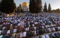 Palestinian Muslims perform Eid al-Fitr prayers in al-Aqsa mosque
