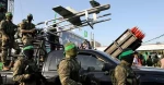 Hamas fighters display weapons in Gaza after truce with Israel
 2