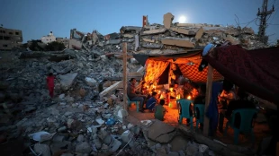 Palestinians in Gaza live by the rubble of their former homes
 8
