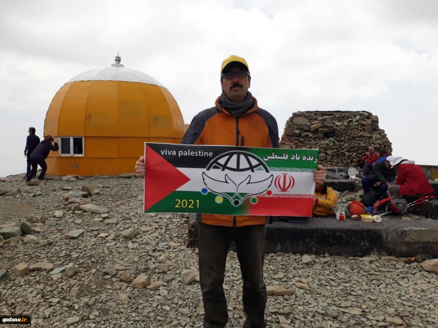 Flag of Palestine waves on peak of Tochal mountain  2