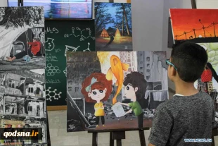 Visitors view artworks made by Palestinian children during exhibition in Gaza City
 3