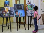 Visitors view artworks made by Palestinian children during exhibition in Gaza City
 5