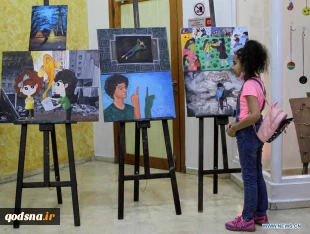 Visitors view artworks made by Palestinian children during exhibition in Gaza City
 5
