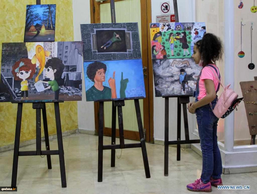 Visitors view artworks made by Palestinian children during exhibition in Gaza City
 5