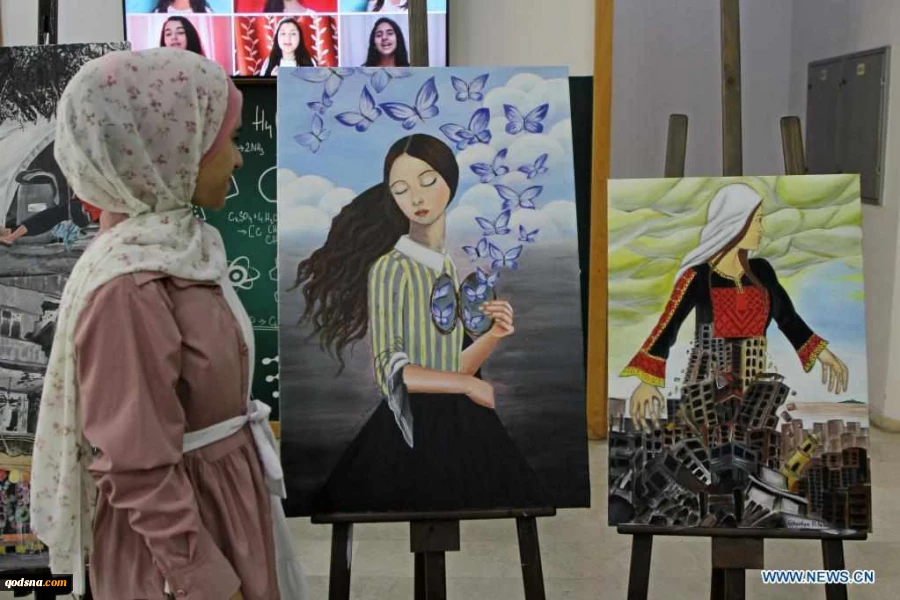 Visitors view artworks made by Palestinian children during exhibition in Gaza City
 6