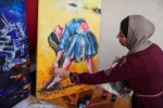 Gaza artist mixes beauty with pain in her ballet paintings
 4