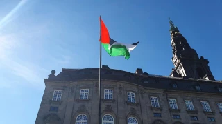 In a first, the flag of Palestine raised at the Danish parliament building