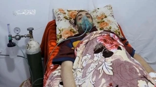 Hamas releases video of captive Israeli in hospital bed