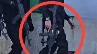 Hamas warns Israel of ‘significant price’ before showing off seized Israeli submachine gun
