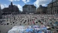Children’s shoes and the names of Gaza’s slain journalists displayed in Amsterdam Square