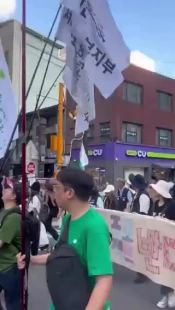 Protesters throw shoes at a poster of Trump and Netanyahu